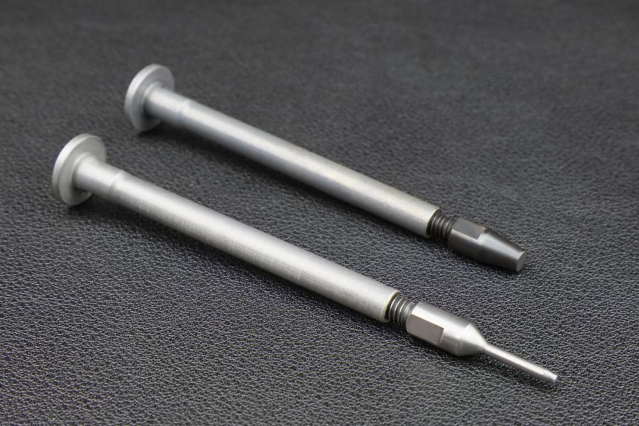 Decapping shaft and pin are interchangable for case hold down